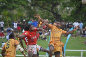 Masivesi Dakuwaqa of Westfield & ratu Josua Kurinabili of Wardens contesting for a kick off at the Coral Coast 7's 2016.