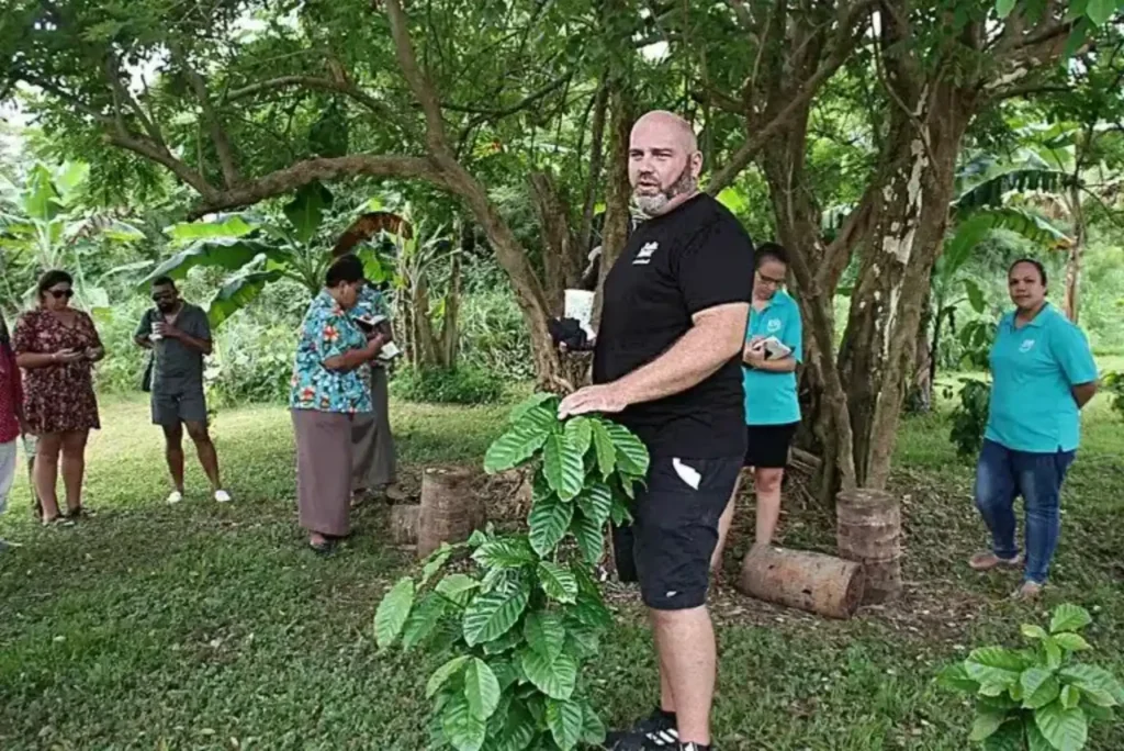 Luke Fryett during a Crop to Cup Coffee Tour, walking the visitors through the harvesting and production of coffee beans. Photo / Supplied